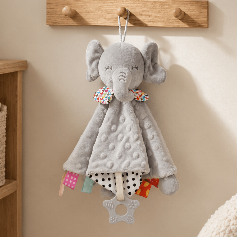 Gray elephant lovey calming baby blanket displayed hanging on a wooden wall hook